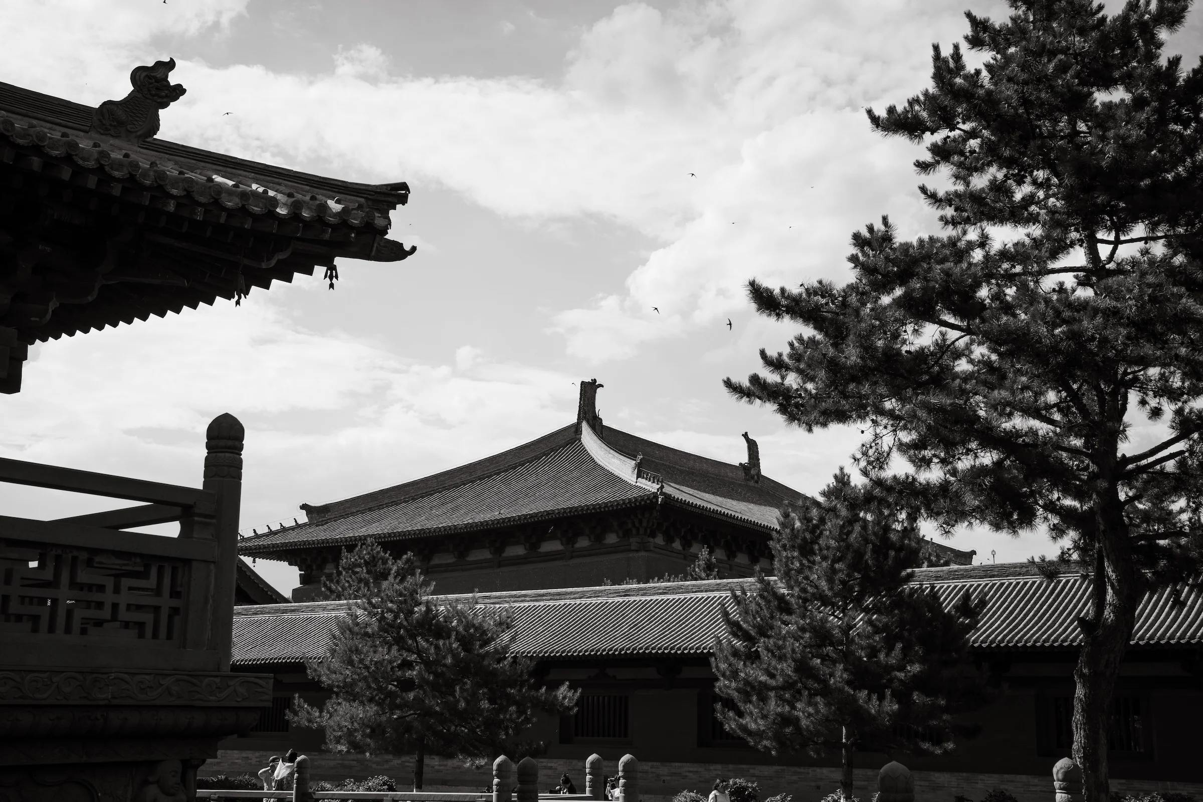 Temple roofs stacked against a hard sky in Datong